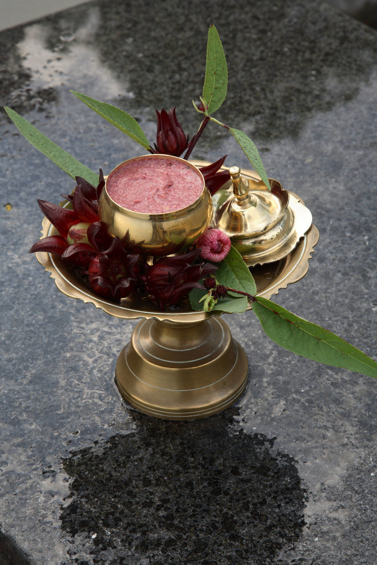Tanjong Jara Resort, Terengganu - A Small Luxury Hotels Of The World Dungun Εξωτερικό φωτογραφία A brass thali with a bell, flowers and a pot of halwa